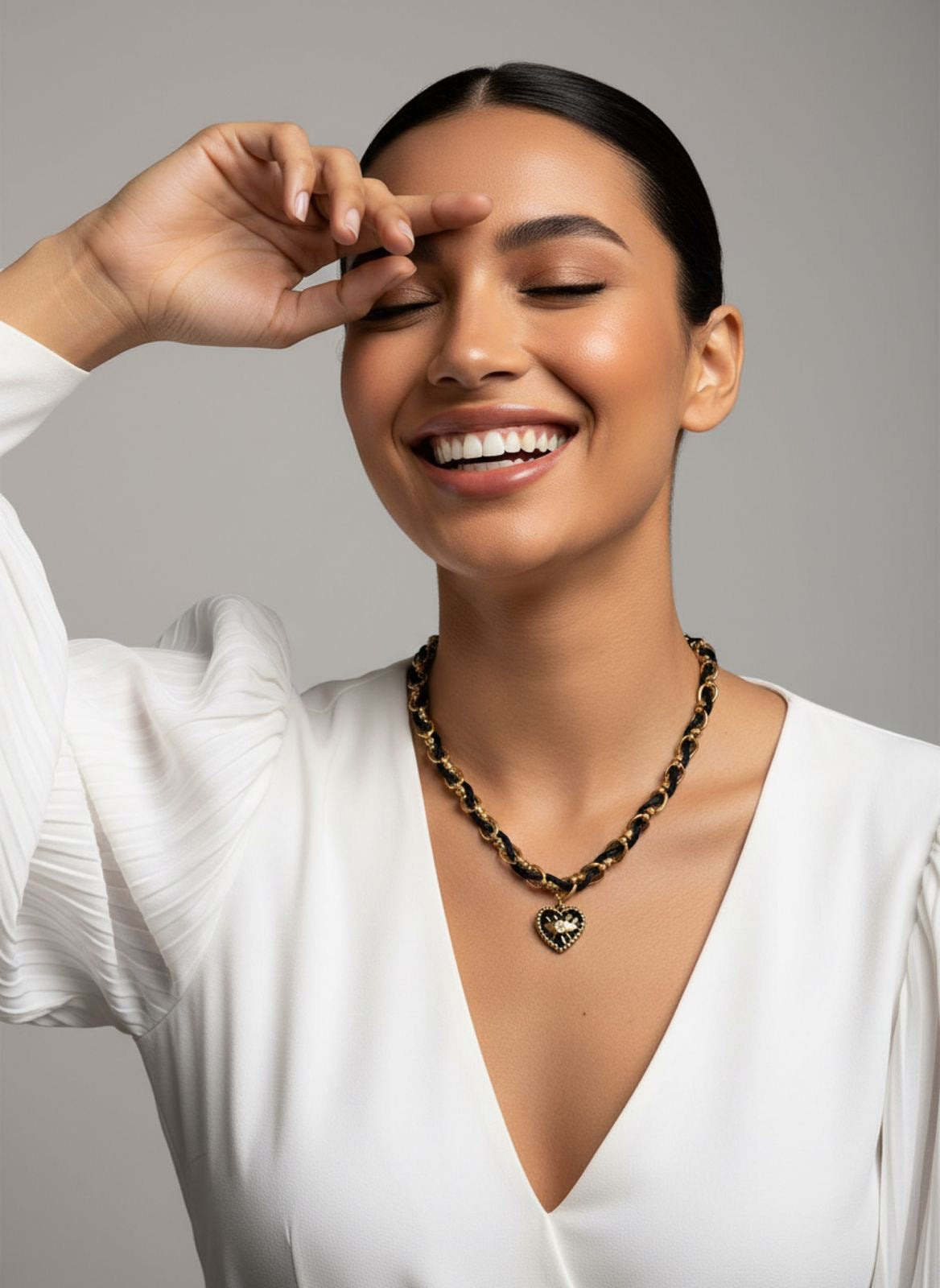 Black cord and gold chain with black heart necklace