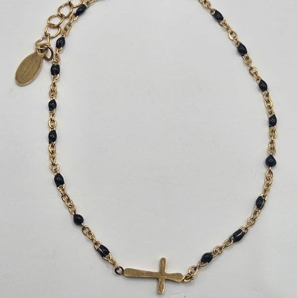 Cross on beaded bracelet