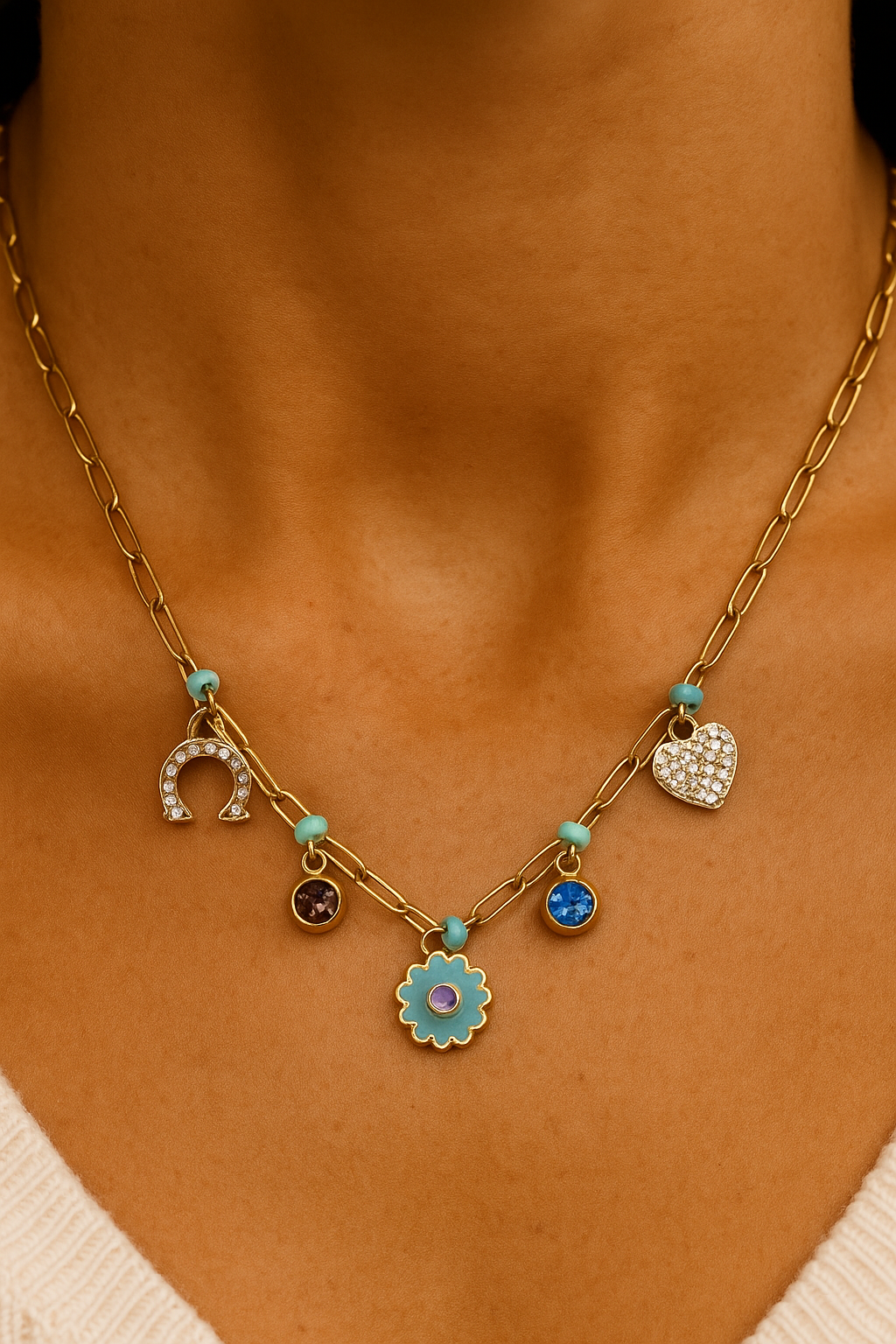 Gold necklace with blue and purple charms