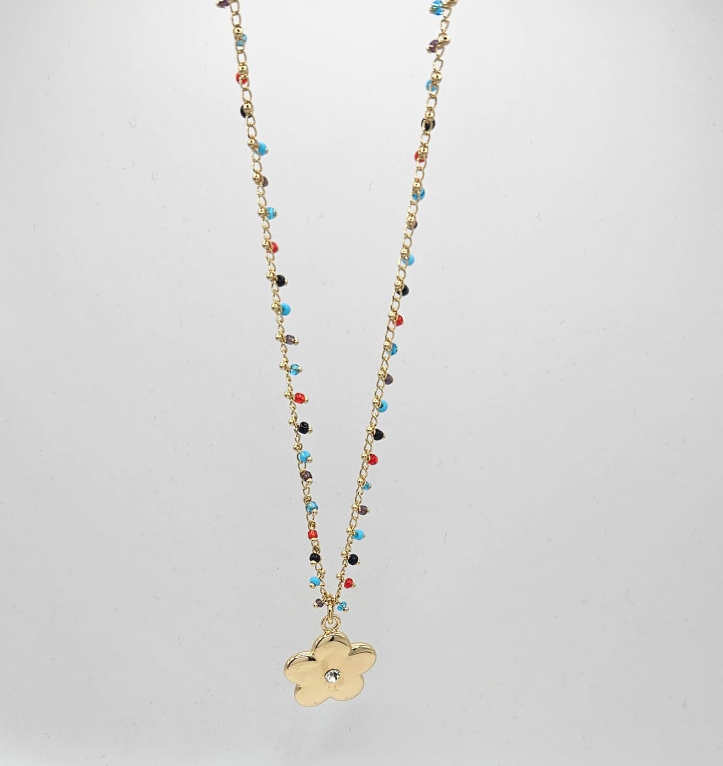 Beaded chain with gold flower charm