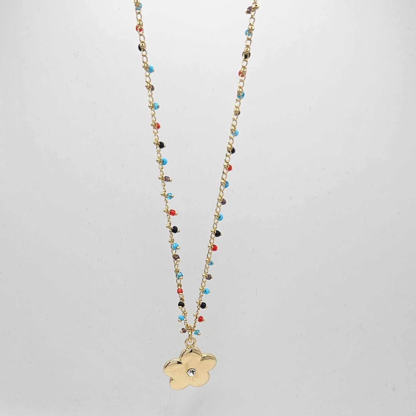Beaded chain with gold flower charm
