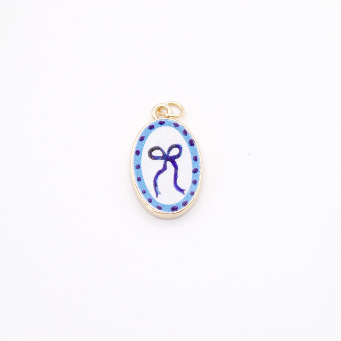 Gold enamel pendant with blue and white design