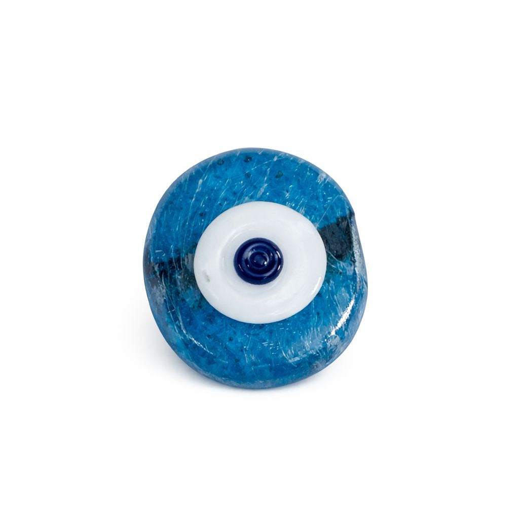 Blue and white evil eye charm on a white centre