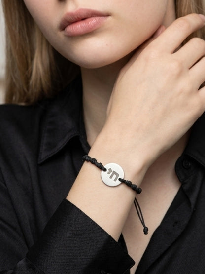 Knotted cord bracelet with chai disc