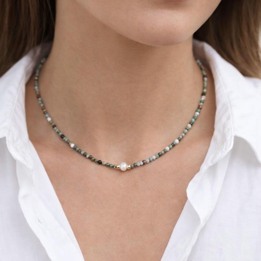 Earthy-toned bead necklace with pearl detail