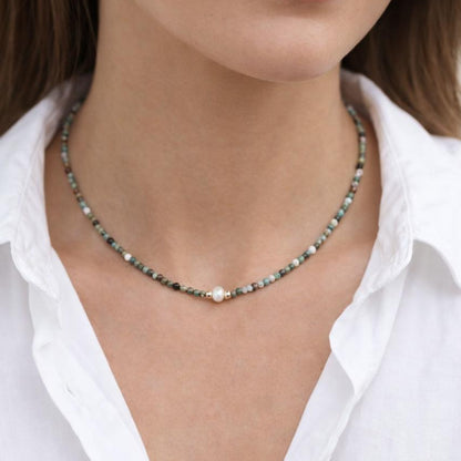 Earthy-toned bead necklace with pearl detail