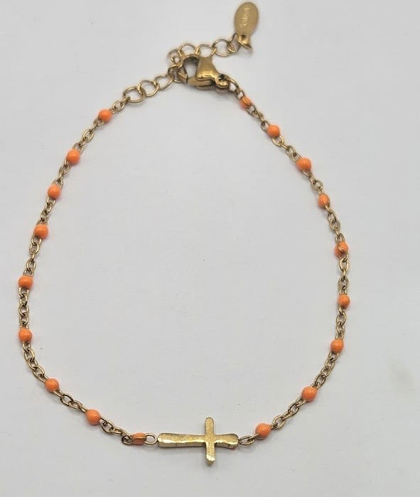 Cross on beaded bracelet