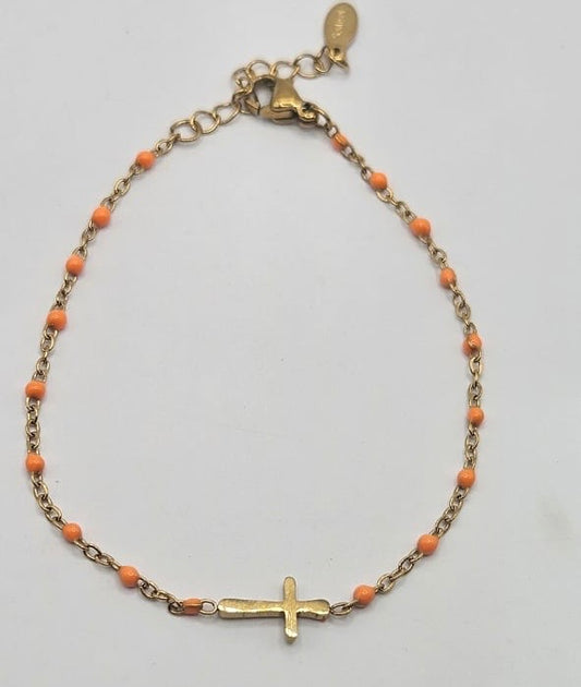 Cross on beaded bracelet