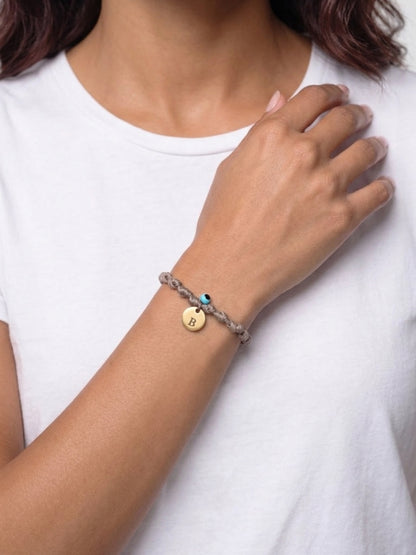 Knotted cord bracelet with gold initial