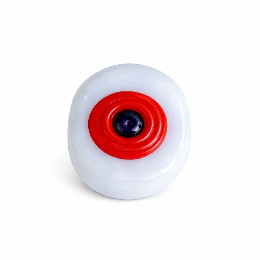 White Evil Eye with a red center on a white background
