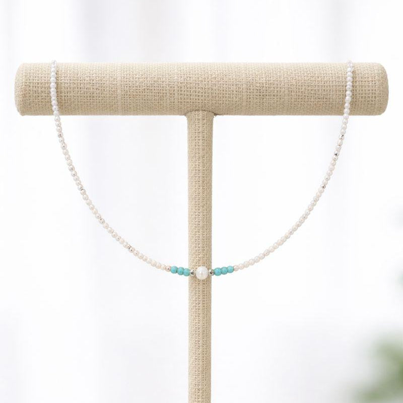 White and turquoise beaded necklace with pearl detail
